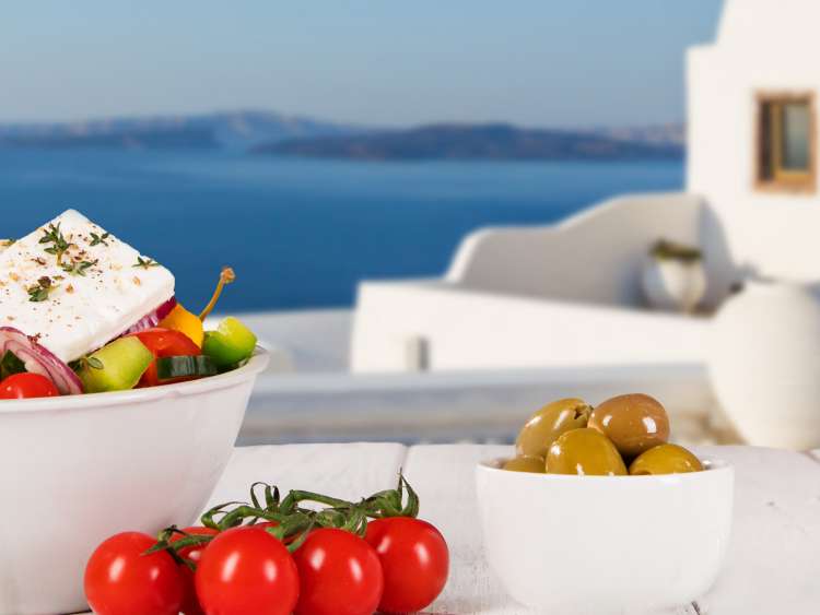 mediterranean olive and tomatoes on a table in santorini, greece