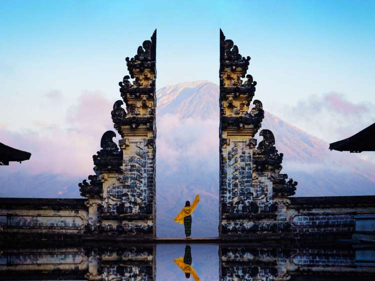 Dancer at ancient gate in Indonesia.