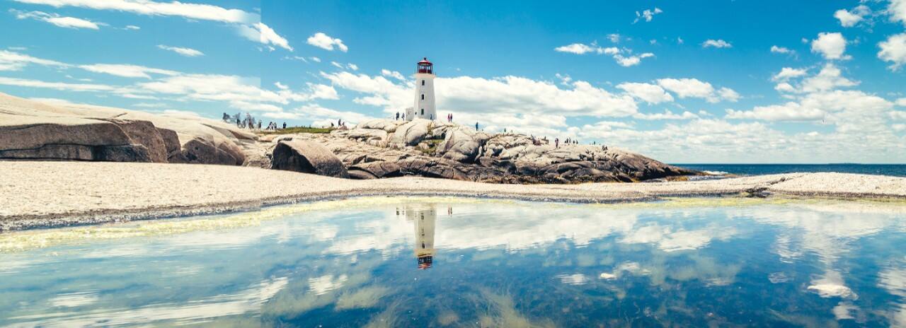 A lighthouse overlooks Peggys Cove in Nova Scotia, Canada.