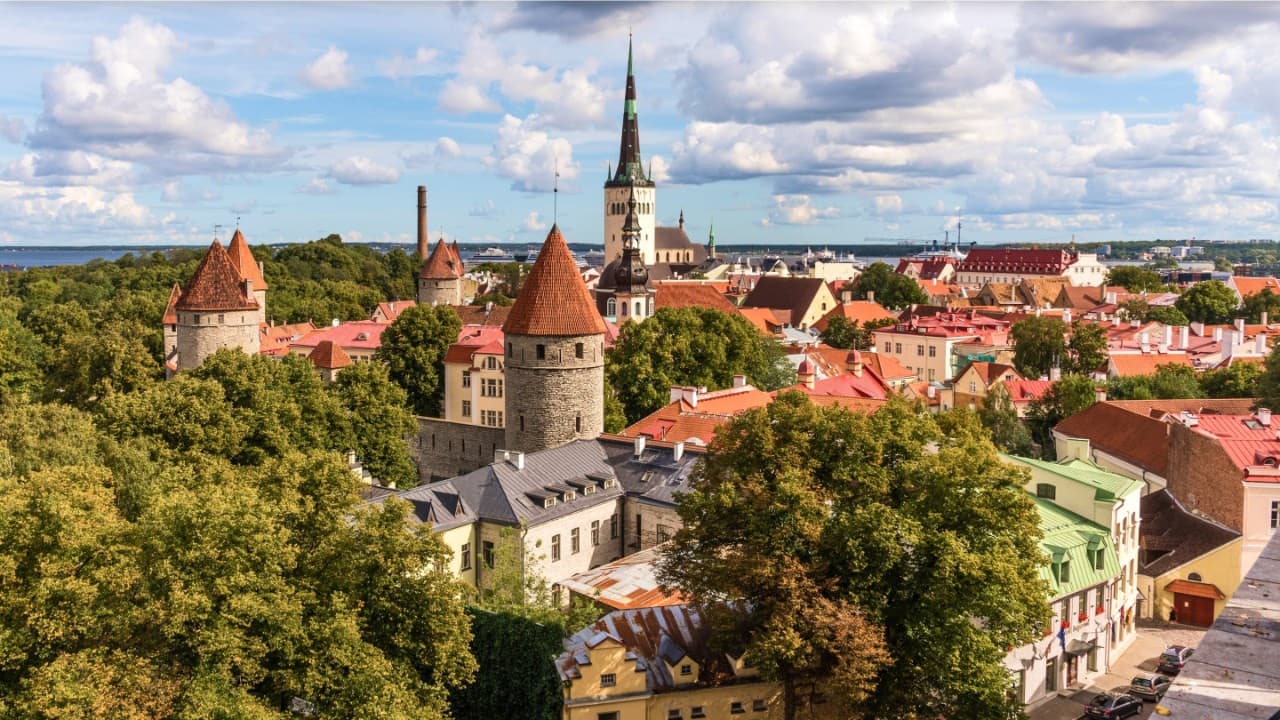View of the red tiled roofs of the Old Town skyline in Tallinn, Estonia.