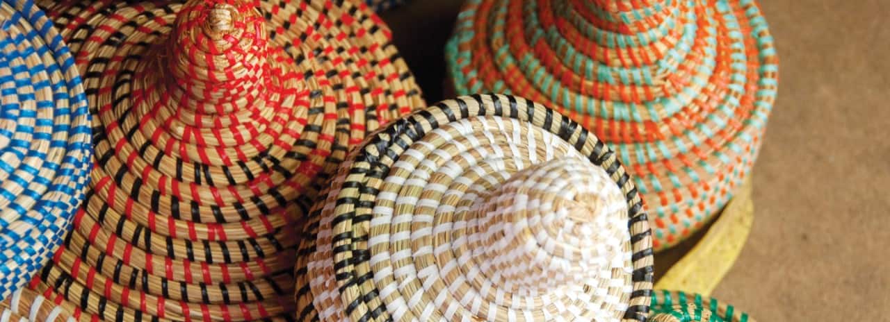 A view of many colorful baskets in the Gambia Banjul Craft Market.