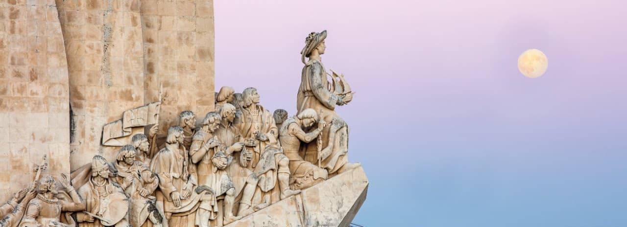 A view of a stone carving of many people lined up in a row.