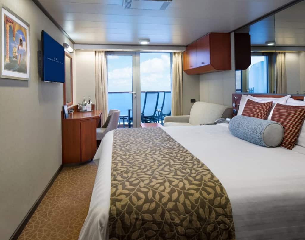 Ocean view Verandah stateroom on board Eurodam with queen-size bed and wall-mounted TV.