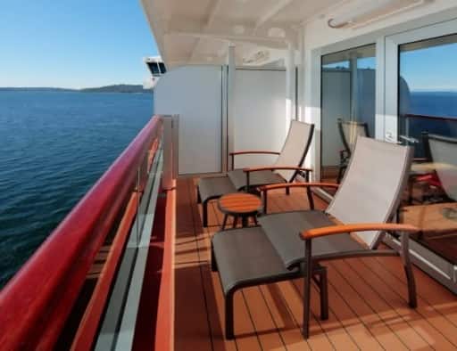 Ocean view balcony of Verandah stateroom on board Eurodam with 2 longue chairs.