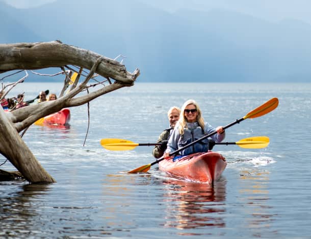 A couple kayaking along the coast near Ketchikan, Alaska
