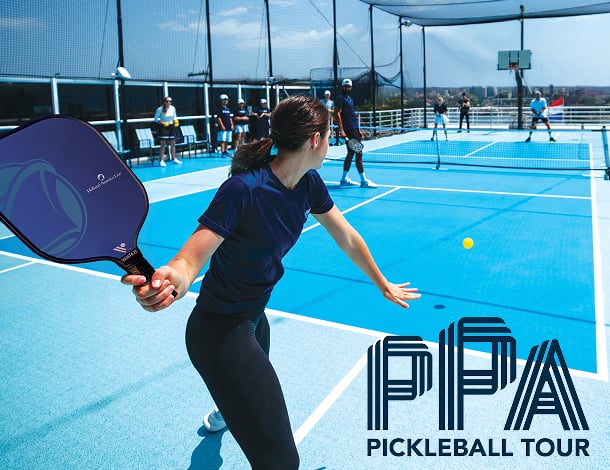 Woman playing pickleball during the PPA Pickleball Tour aboard a Holland America cruise ship