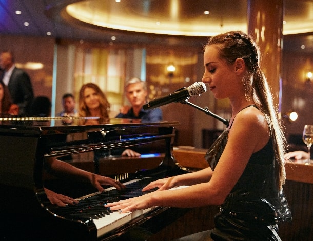 Woman playing piano at Billboard Piano Bar