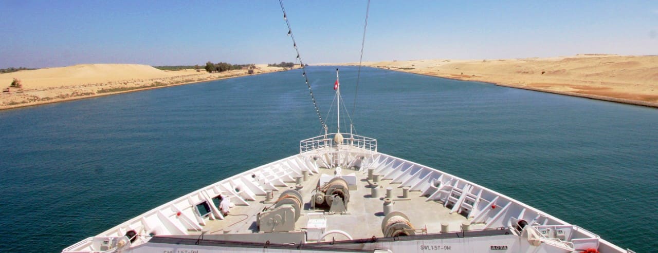 A ship's bow view of tranversing the Suez Canal