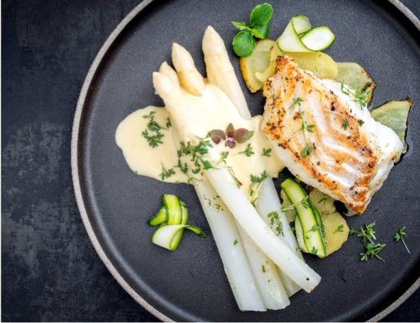 Seared Atlantic Haddock served on a round plate