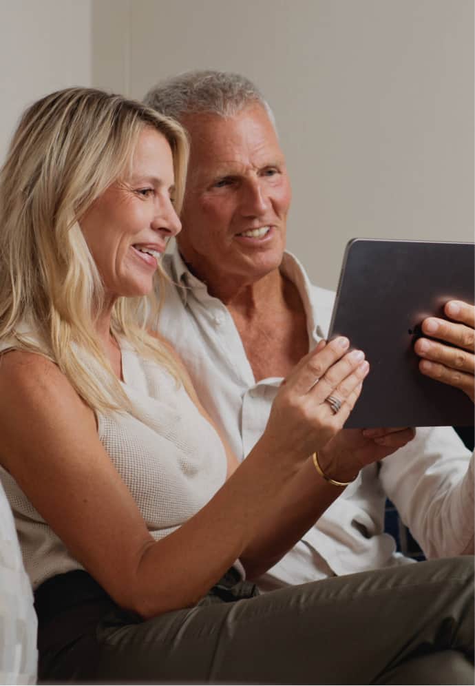 Couple reading on tablet