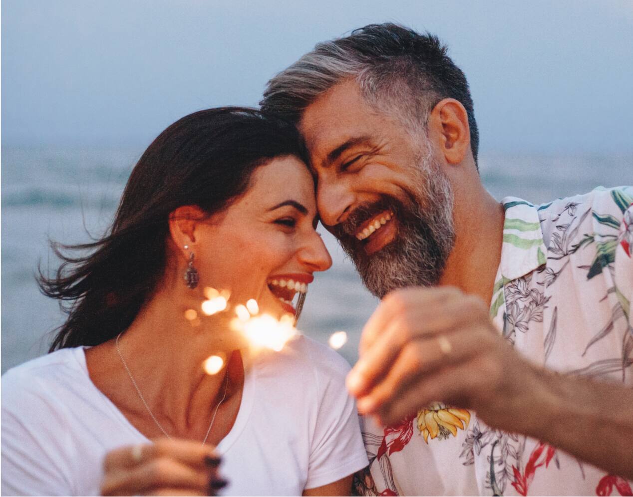 Couple holding sparklers