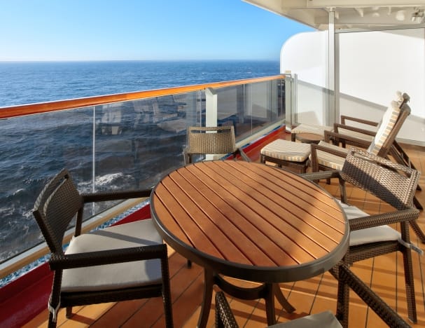 Deck chairs and table on private veranda.