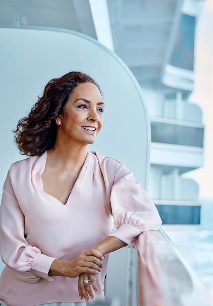Woman standing on veranda.