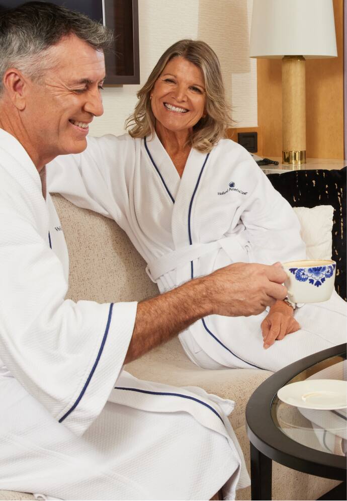 Couple relaxing in bath robes.