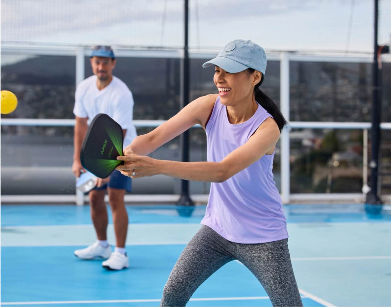 People playing pickleball on ship's top deck 