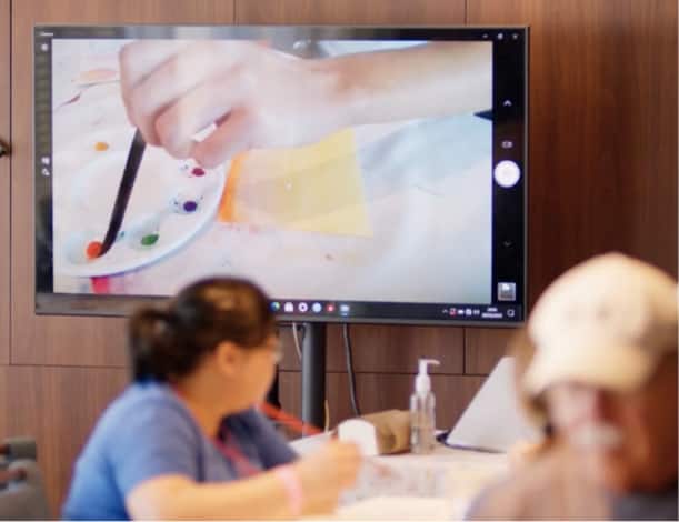 Woman taking a painting class