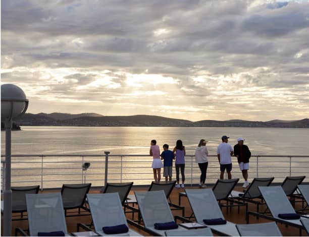 Guest watching sunset from promenade