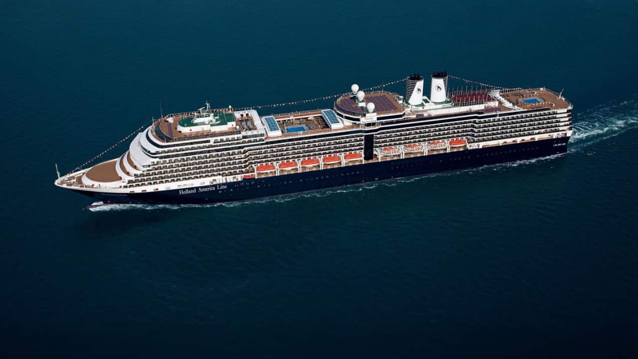 Holland America Nieuw Amsterdam cruise ship sailing on the ocean.