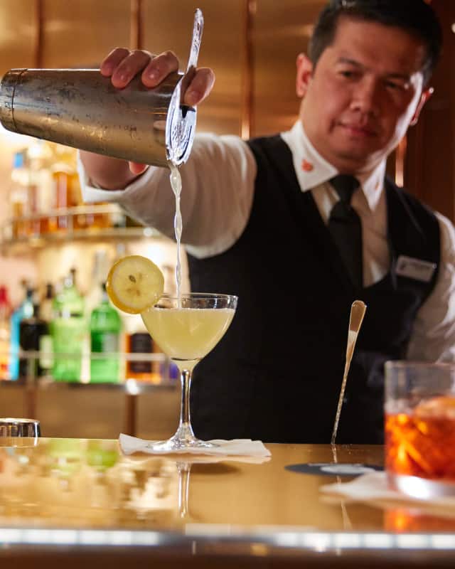 Bartender serving a cocktail