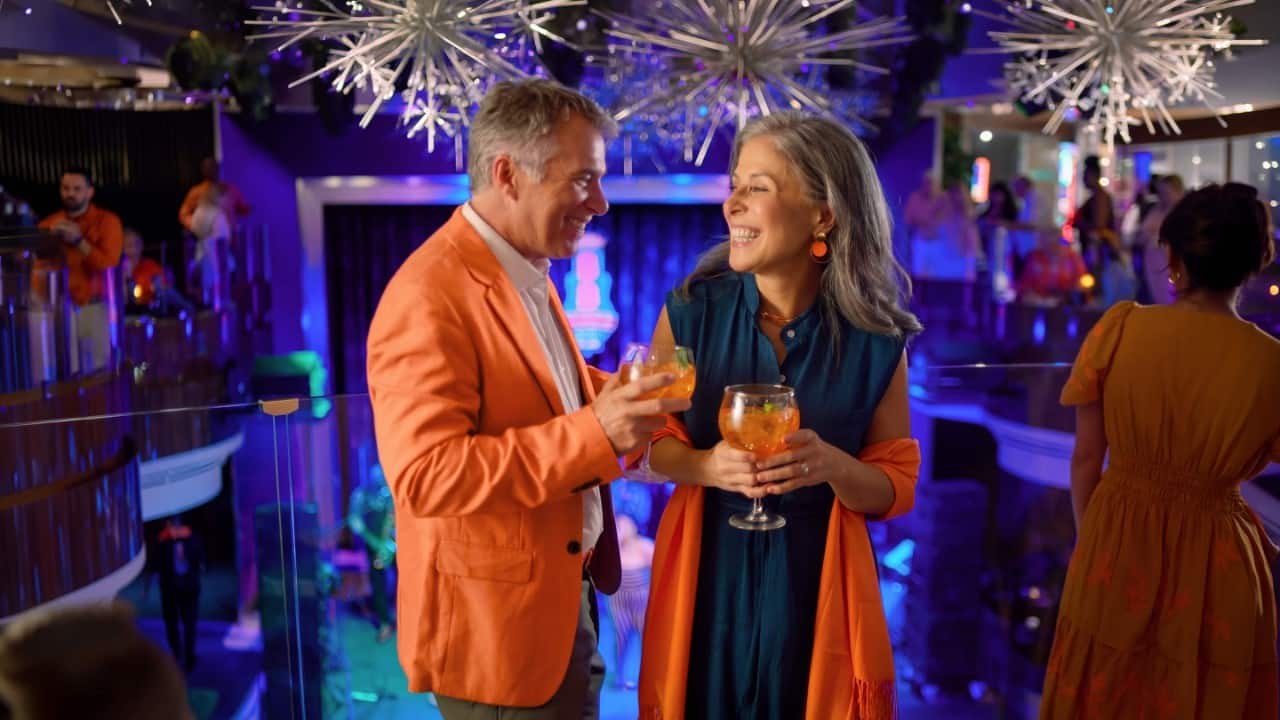 Couple celebrating during the Orange Party.