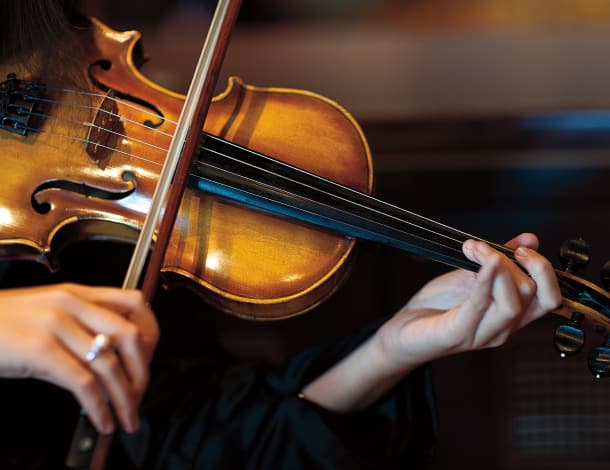 Onboard violinist in performance