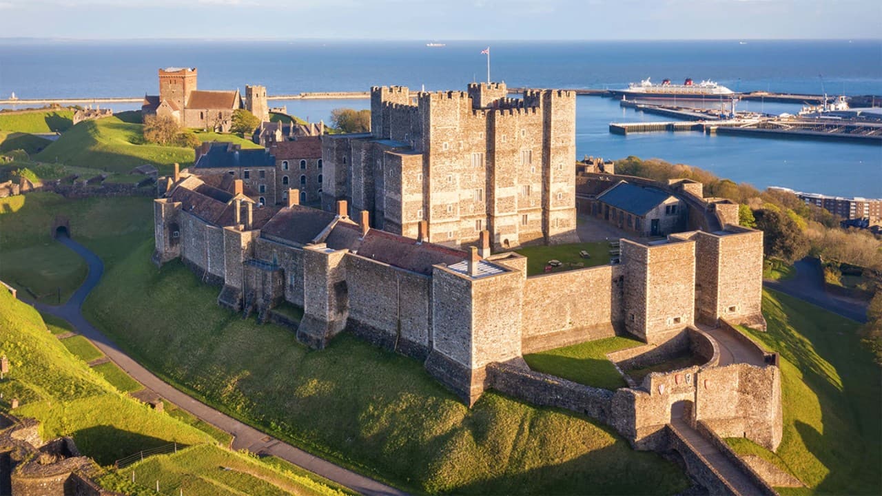 Dover, England, United Kingdom - May 10, 2021: View of Dover castle and harbour at sunset.