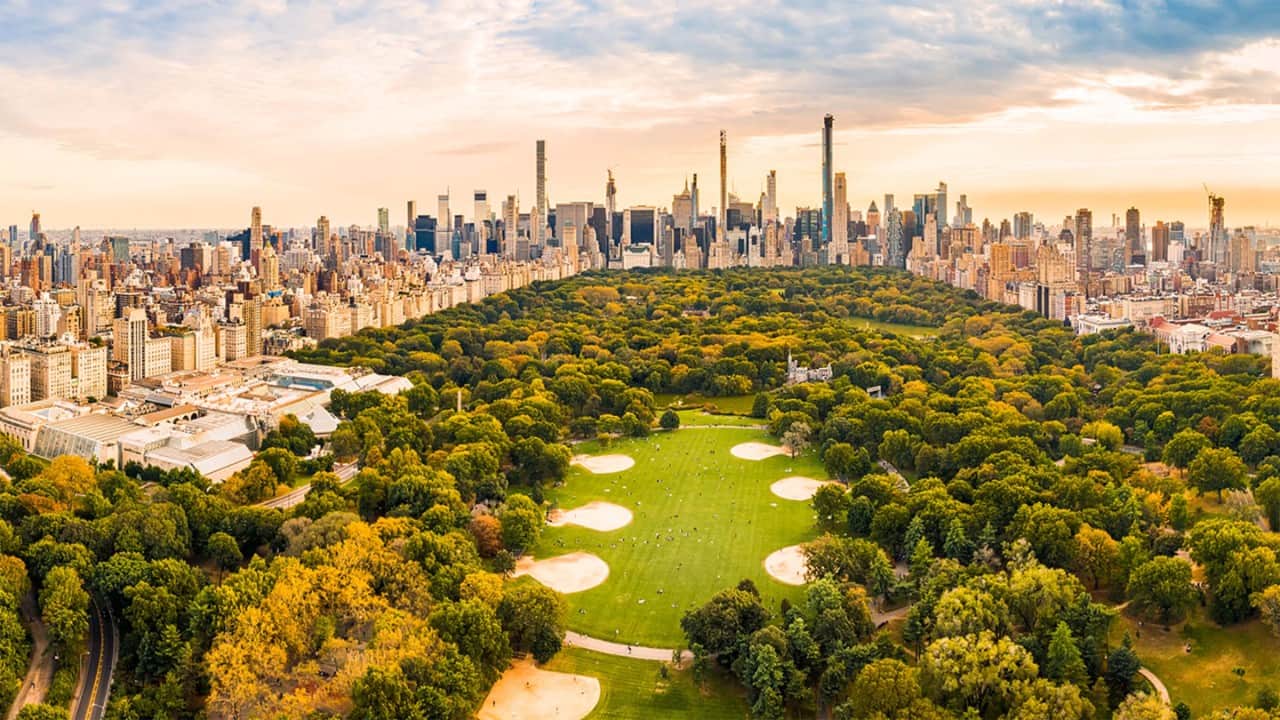 The New York City skyline, seen from across the river, with the Empire State Building prominently featured in the center
