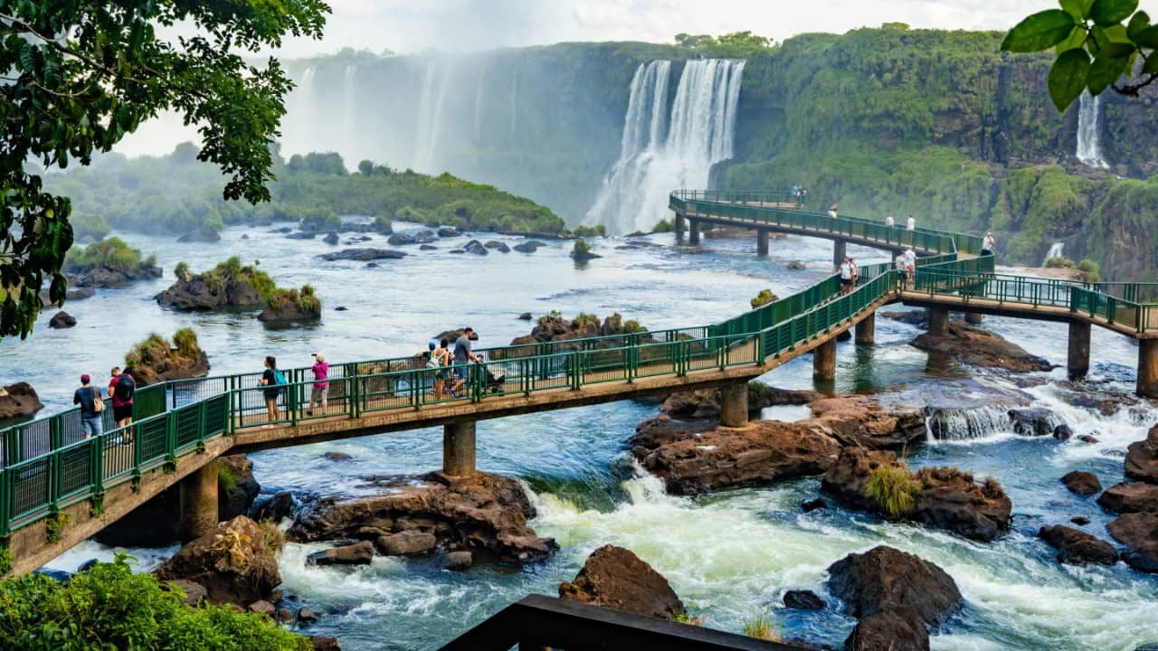 Visitors cross a series of bridges at Iguazu Falls in Argentina.
