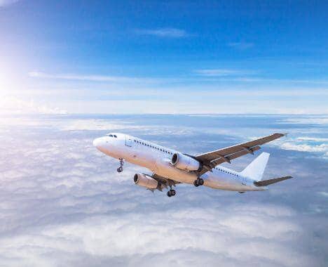 Airplane flying above clouds